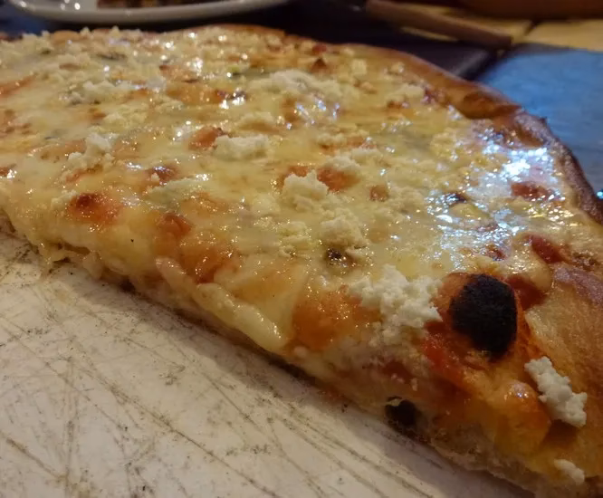 ¿Cuántas rebanadas de pizza come una persona?